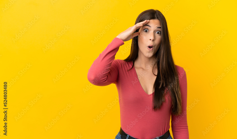 Teenager Brazilian girl over isolated yellow background has realized something and intending the solution Teenager Brazilian girl over isolated yellow background has realized something and intending the solution