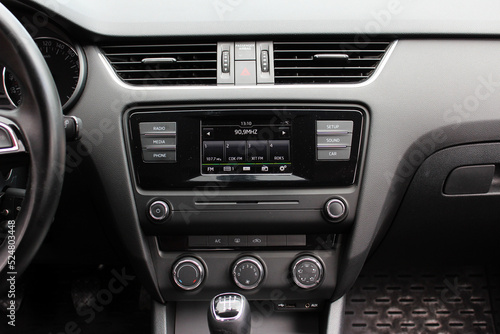 View of dashboard with multimedia system in modern car. Modern car dashboard. Screen multimedia system. 