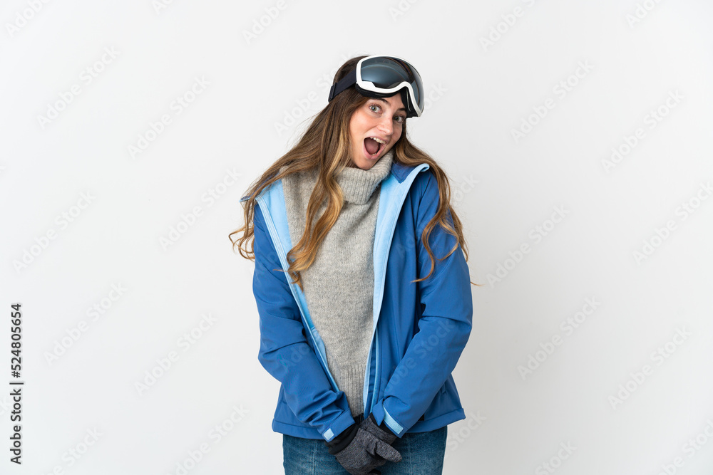 Skier girl with snowboarding glasses isolated on white background with surprise facial expression Skier girl with snowboarding glasses isolated on white background with surprise facial expression