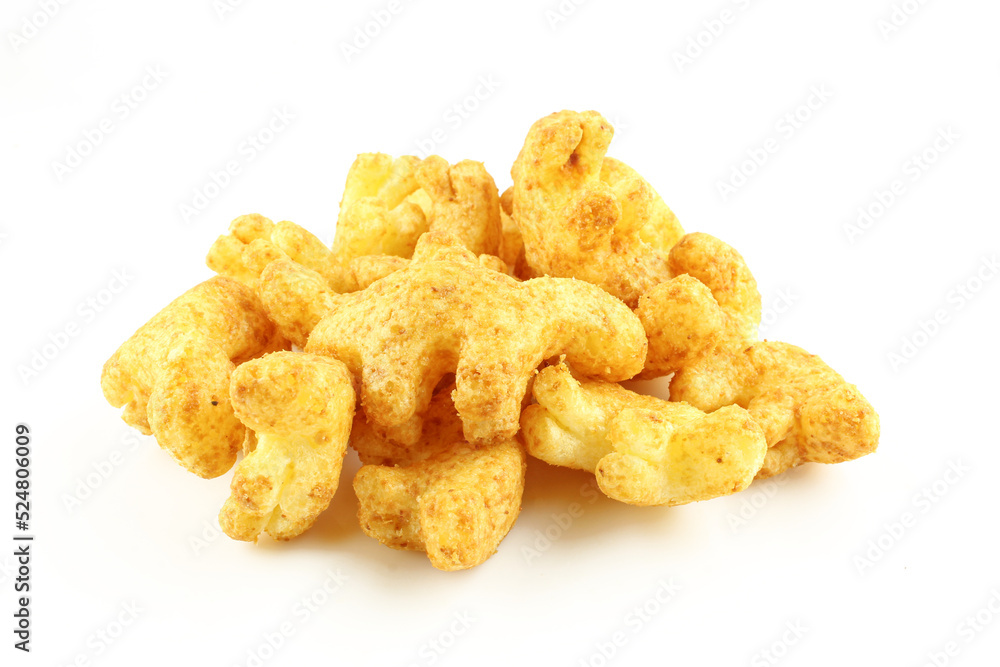 Pile of dinosaur shaped peanut puff snacks isolated on white background Pile of dinosaur shaped peanut puff snacks isolated on white background