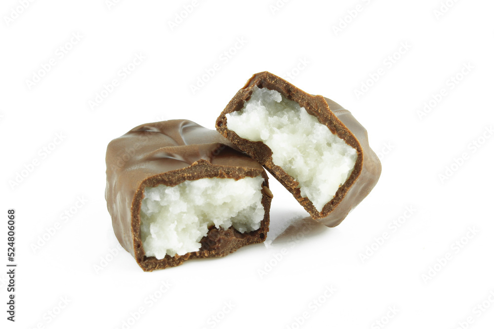 Two pieces of broken coconut filled chocolate bar isolated on white background Two pieces of broken coconut filled chocolate bar isolated on white background