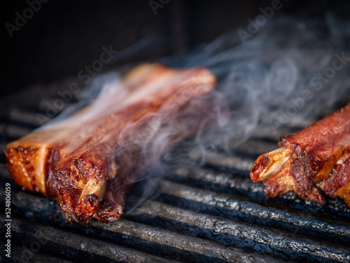 Isolated close up of delicious pork spare ribs roasted on the grill