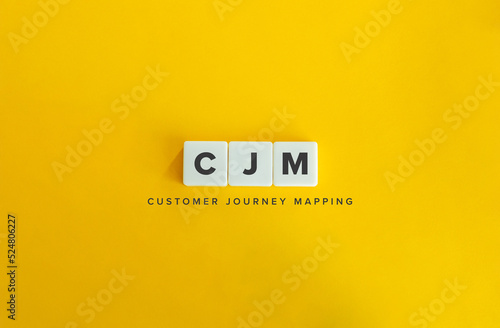 Customer Journey Mapping (CJM) Banner. Letter Tiles on Yellow Background. Minimal Aesthetics.