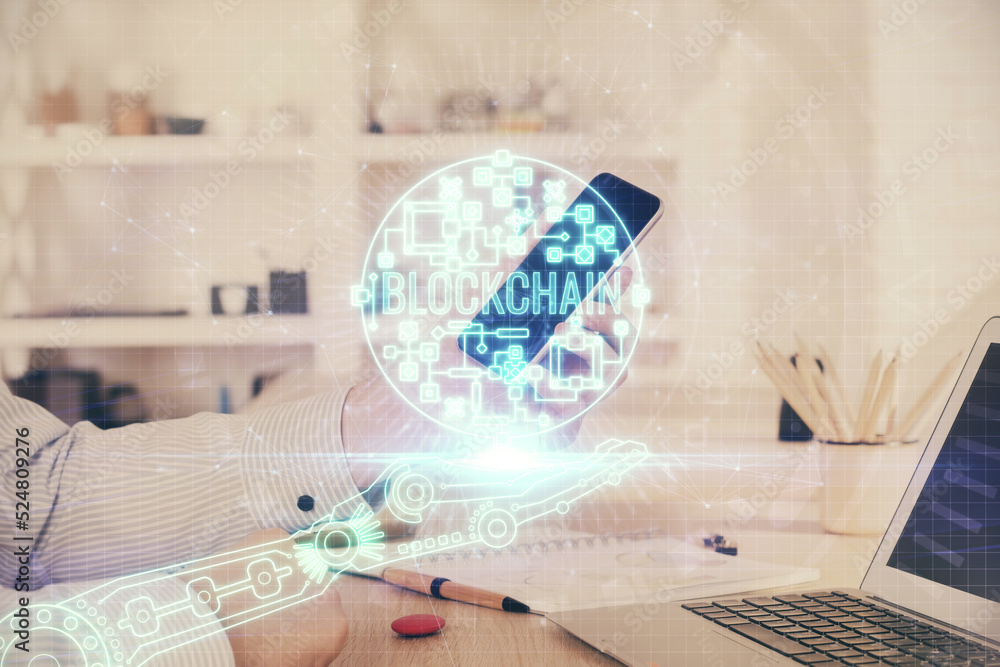 Double exposure of man's hands holding and using a phone and crypto currency blockchain theme drawing. Double exposure of man's hands holding and using a phone and crypto currency blockchain theme drawing.