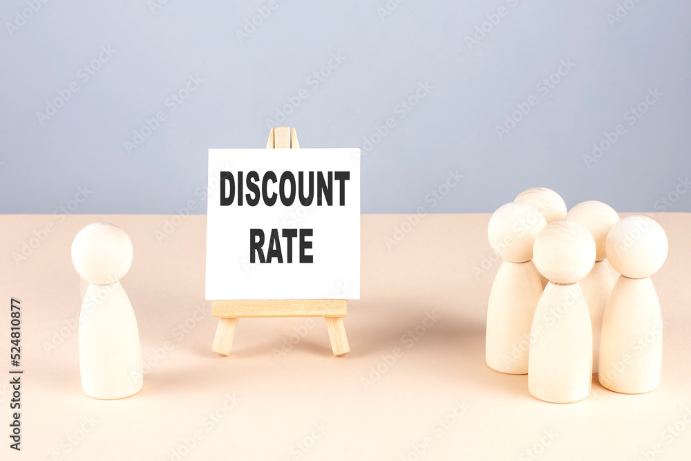 DISCOUNT RATE text on easel with wooden figure, meeting concept DISCOUNT RATE text on easel with wooden figure, meeting concept