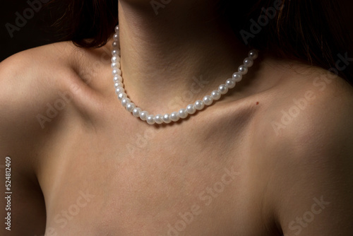 Women's collarbones and shoulders. Delicate photograph of body parts