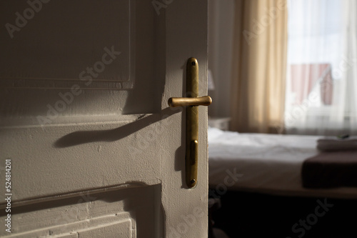 vintage white door opening into bedroom
