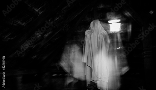 blurred image of ghost in the attic haunted house for Halloween