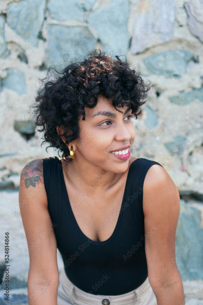 Crop lonely black woman with tattoo and piercing Crop lonely black woman with tattoo and piercing
