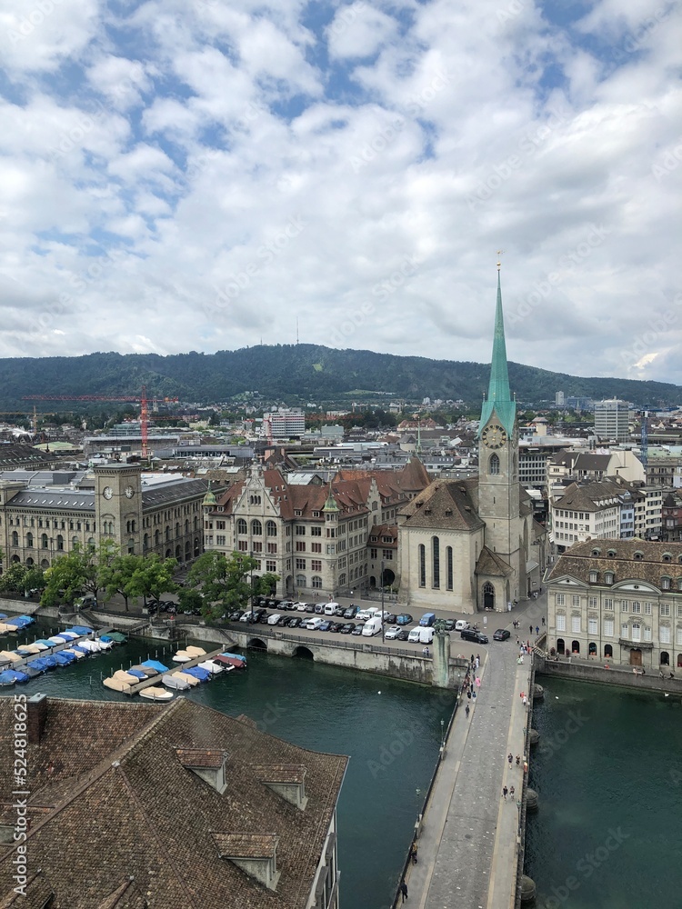 Zurich Panoramic view with Fraumünster, Switzerland , shot from the top of Grossmunster in summer 2022. Swiss lake, cathedrals, yachts, cars, roofs, historic buildings, main landmarks and sightseeings