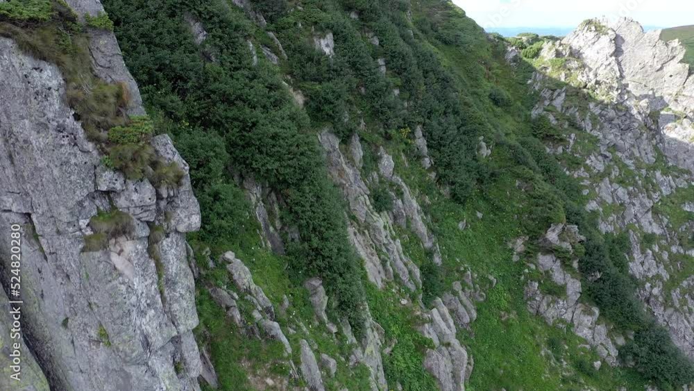 Aerial view of rocky peak of Spitz mountain in the Carpathian mountains, landscape of summer mountains. Aerial view of rocky peak of Spitz mountain in the Carpathian mountains, landscape of summer mountains.