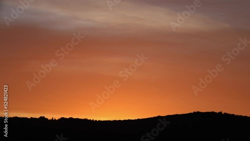 Wallpaper Mural sunrise timelapse with mountains and red sky, illuminated clouds Torontodigital.ca