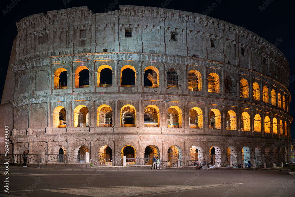 Evening photo with an illuminated Colosseum in Rome