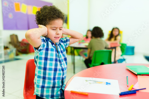 Overwhelmed preschooler with autism in kindergarten
