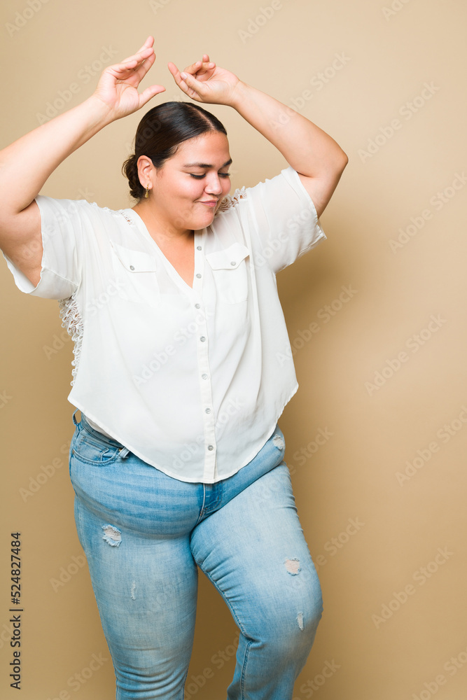 Young obese woman having fun and enjoying a fun dance Young obese woman having fun and enjoying a fun dance