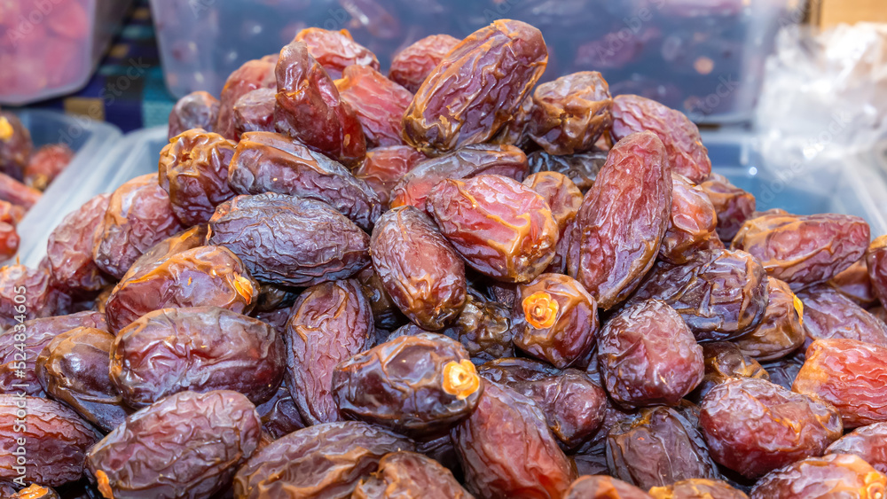 Dates are sold at a dried fruit market. Close-up