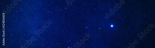 tellar Milky Way at night with stars. Panorama of the dark blue starry sky © alexkoral