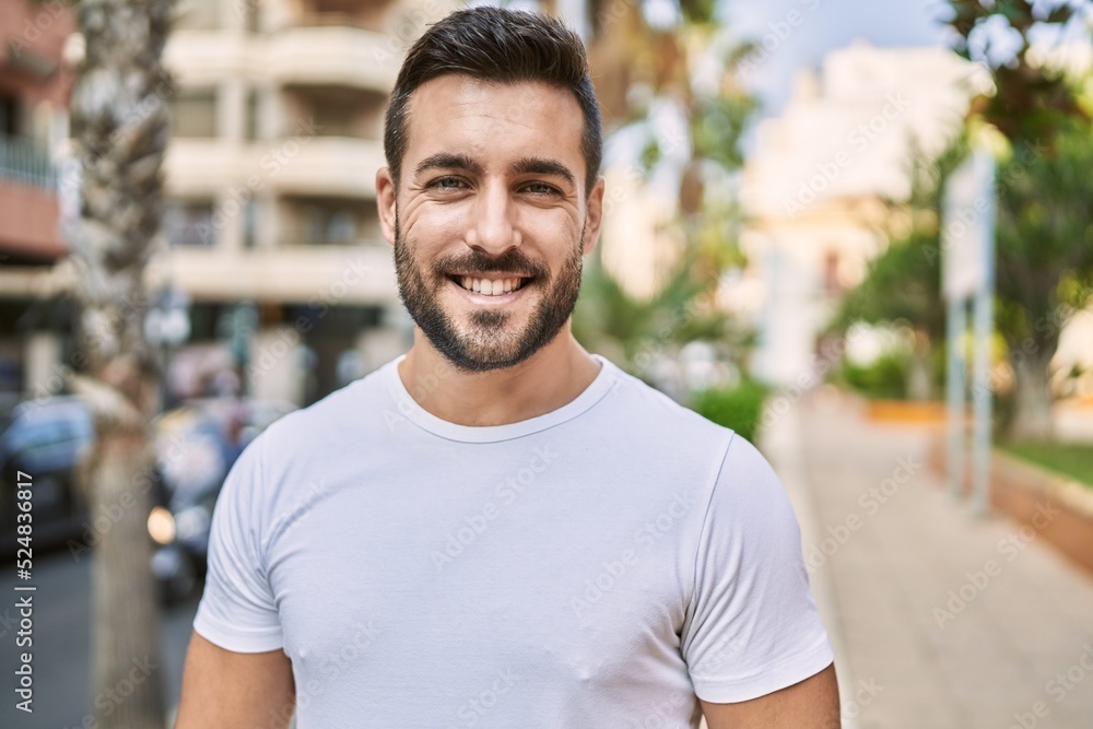 Young hispanic man smiling confident walking at street Young hispanic man smiling confident walking at street