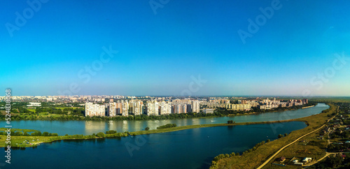 Landscape of the city by the river - the outskirts of the city of Krasnodar (South of Russia) near the Kuban River and Lake Starobzhegokai on a sunny summer day