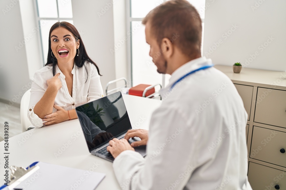 Young hispanic woman at the doctor pointing finger to one self smiling happy and proud Young hispanic woman at the doctor pointing finger to one self smiling happy and proud