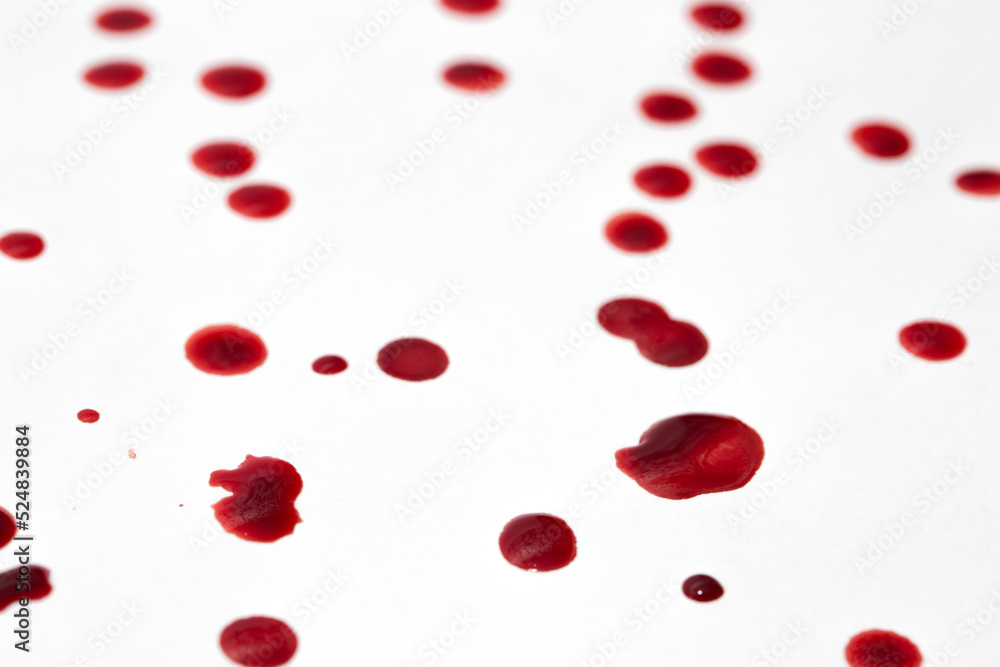 Drops of blood staining spots on a white background, medecine, drug addiction, killing