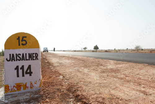 Milestone on the road to Jaisalmer, Thar Desert, Rajasthan, India, Asia photo