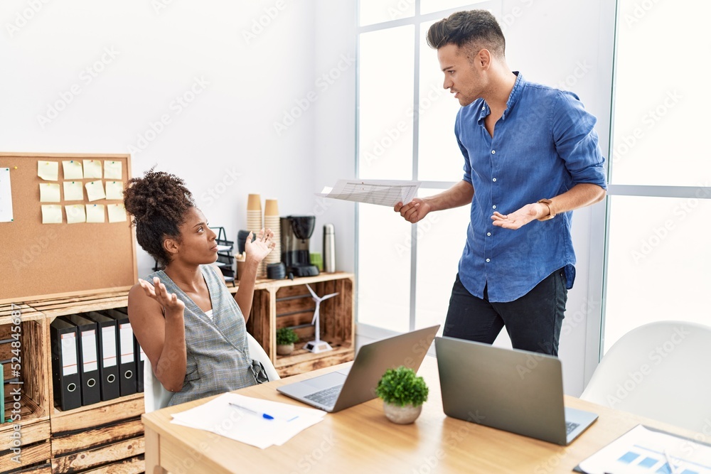 Man and woman business workers arguing at office Man and woman business workers arguing at office