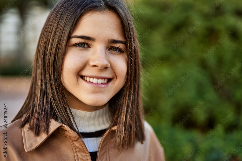 Young beautiful brunette woman smiling happy outdoors Young beautiful brunette woman smiling happy outdoors