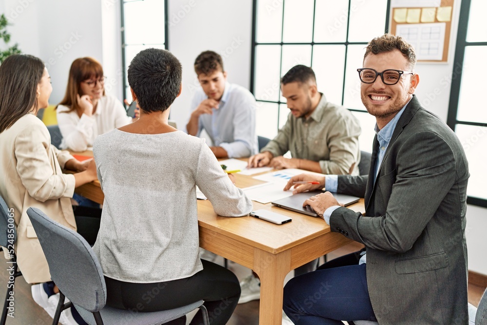 Group of business workers smiling happy working at the office.