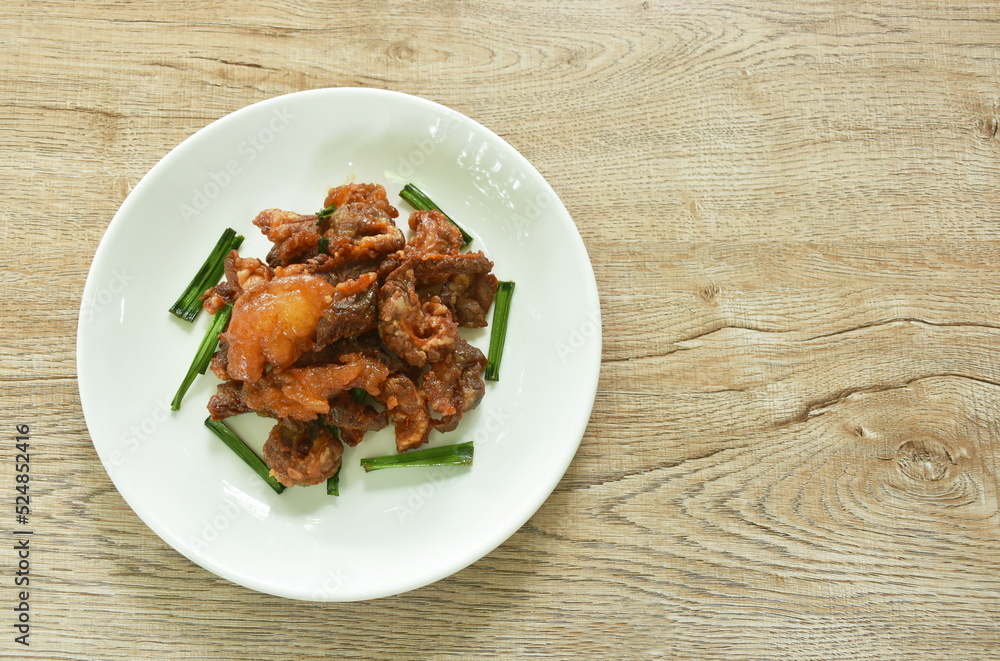 spicy stir fried chicken and bell pepper with chili paste on plate spicy stir fried chicken and bell pepper with chili paste on plate
