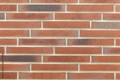 Decorative Relief Facing Plates Imitating red Brick On The Wall. Textured brick background.
