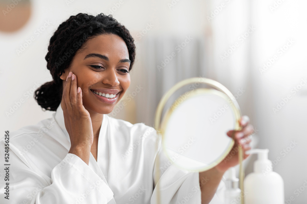 Attractive Black Woman Looking At Mirror And Touching Perfect Skin On Face Attractive Black Woman Looking At Mirror And Touching Perfect Skin On Face