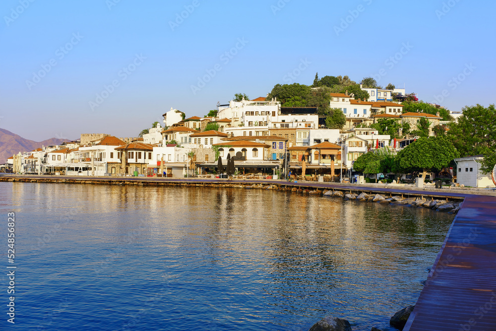 View from the sea in the morning hours on the buildings and cafes of the old city in Marmaris. Turkey