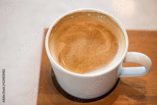 hot coffee cappuccino cup in the milk froth