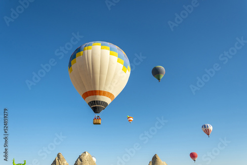 Hot air balloon flight over Cappadocia  Turkey  Goreme village  hot air balloon parade