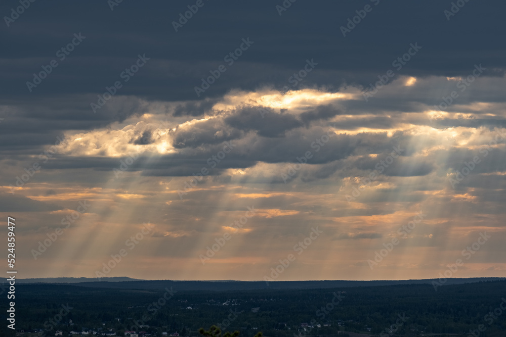 Fototapeta premium Lightbeams Shining Trough the Clouds