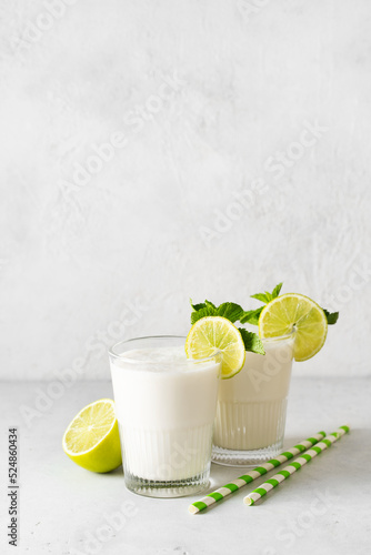 Lime and coconut cocktail drink summer alcohol beverage close up