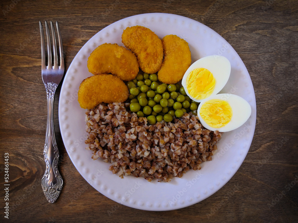 Useful and tasty breakfast. Egg, buckwheat, green peas