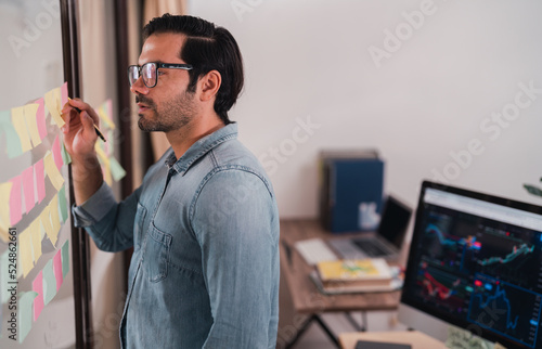 entrepreneurial executives sitting smiling. business manager lifestyle Indoor self-confidence.professional male technical young white computer company work laptop