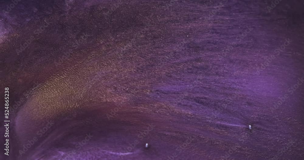 Shining golden sparkles spread in lilac liquid, abstract background. Purple paint moving, flowing liquid. Shining violet moving. Slow motion art. 4k vertical video backdrop. Watercolor paints backdrop Shining golden sparkles spread in lilac liquid, abstract background. Purple paint moving, flowing liquid. Shining violet moving. Slow motion art. 4k vertical video backdrop. Watercolor paints backdrop