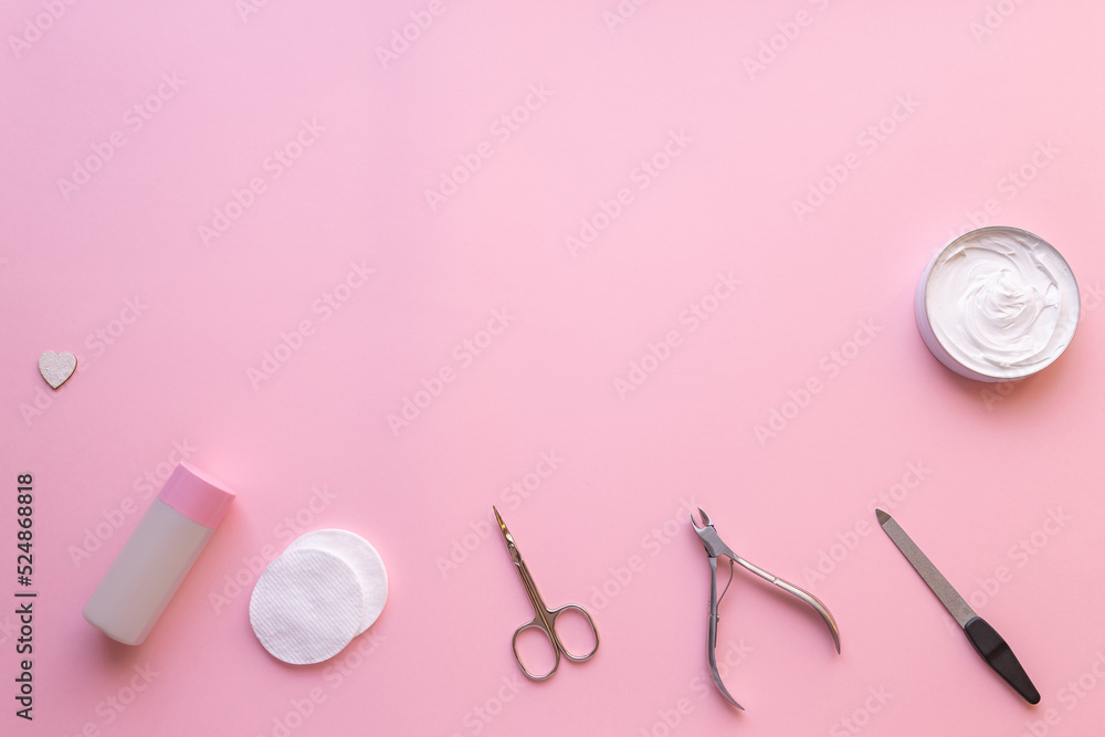Set of manicure and pedicure tools on pink background Set of manicure and pedicure tools on pink background