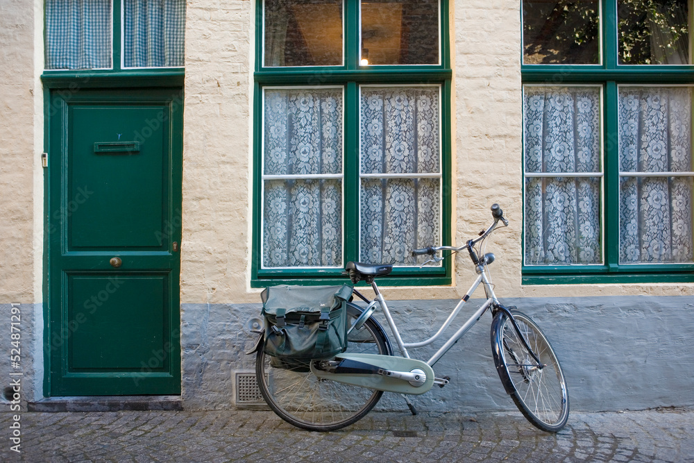 Peerdenstraat: a quiet, narrow lane with an old Flemish house and attendant bicycle, Brugge, Belgium