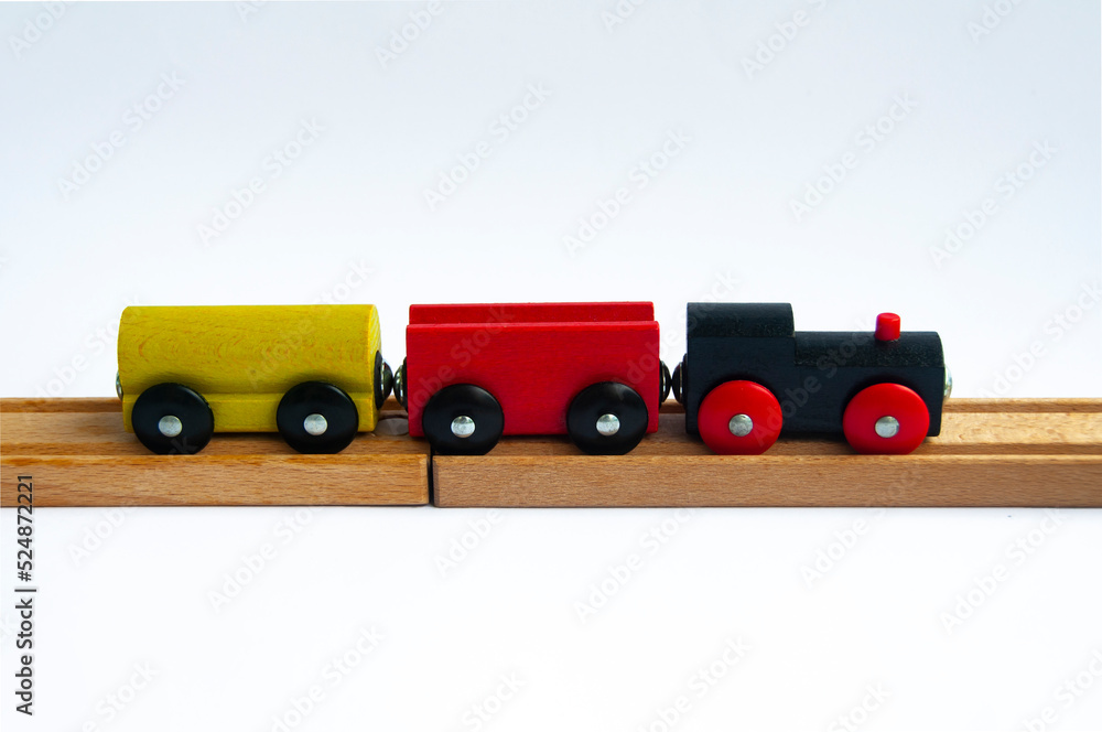 Wooden toy train on white background. Toy and transportation concept Wooden toy train on white background. Toy and transportation concept