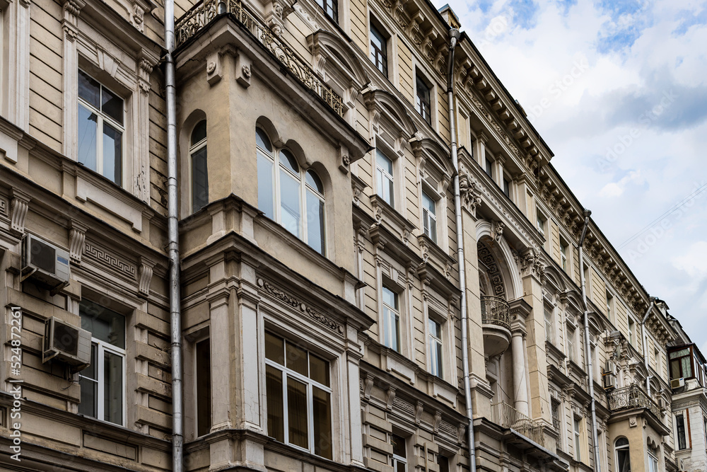 facade of old apartment house on Ostozhenka street in Moscow city in evening