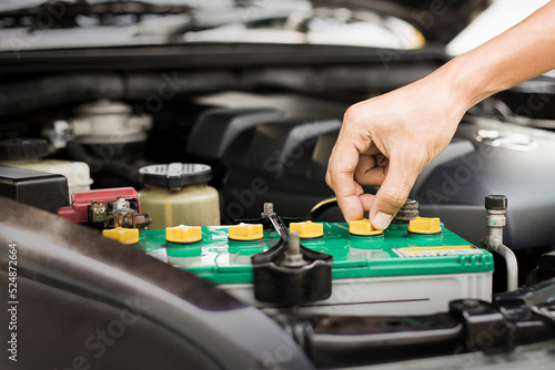 Technicians inspect the car's electrical system.