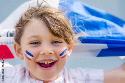 Beautiful little girl who supports France with her flag 