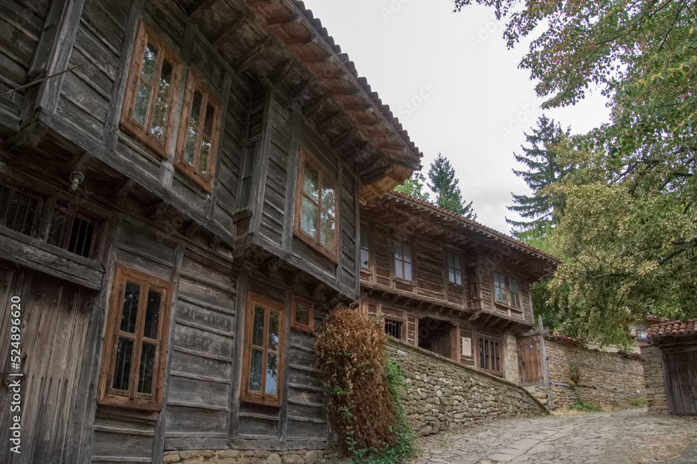 Street with traditional wooden houses at the village of Zheravna, Bulgaria Street with traditional wooden houses at the village of Zheravna, Bulgaria