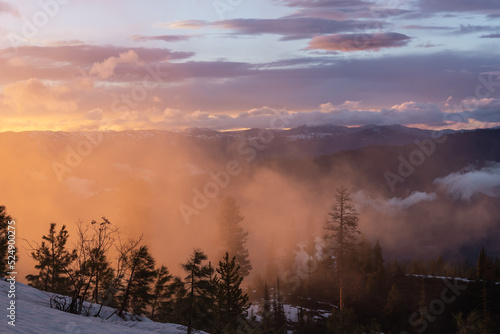sunset over the hillside near Idaho city outside of a yurt during the snowy winter season