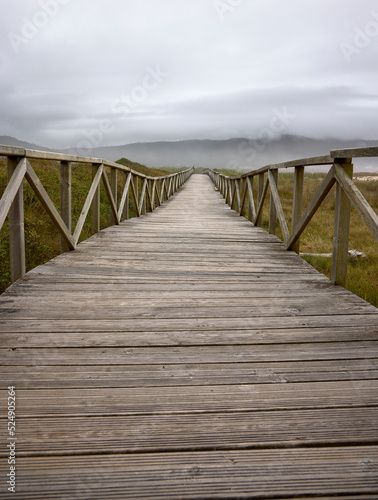 Laxe (Spain), August 20, 2022. Wooden footbridge. Footbridge to cross the dunes of Traba beach. © Ricardo
