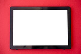 Digital mockup. Online technology. Internet connection. Tablet computer with white blank screen isolated red.